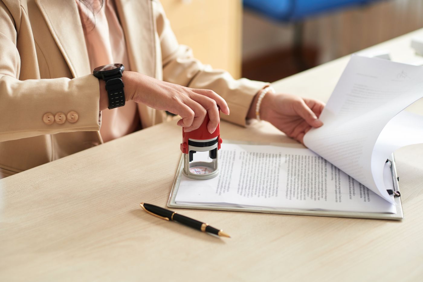 Notary stamping an official document at the office